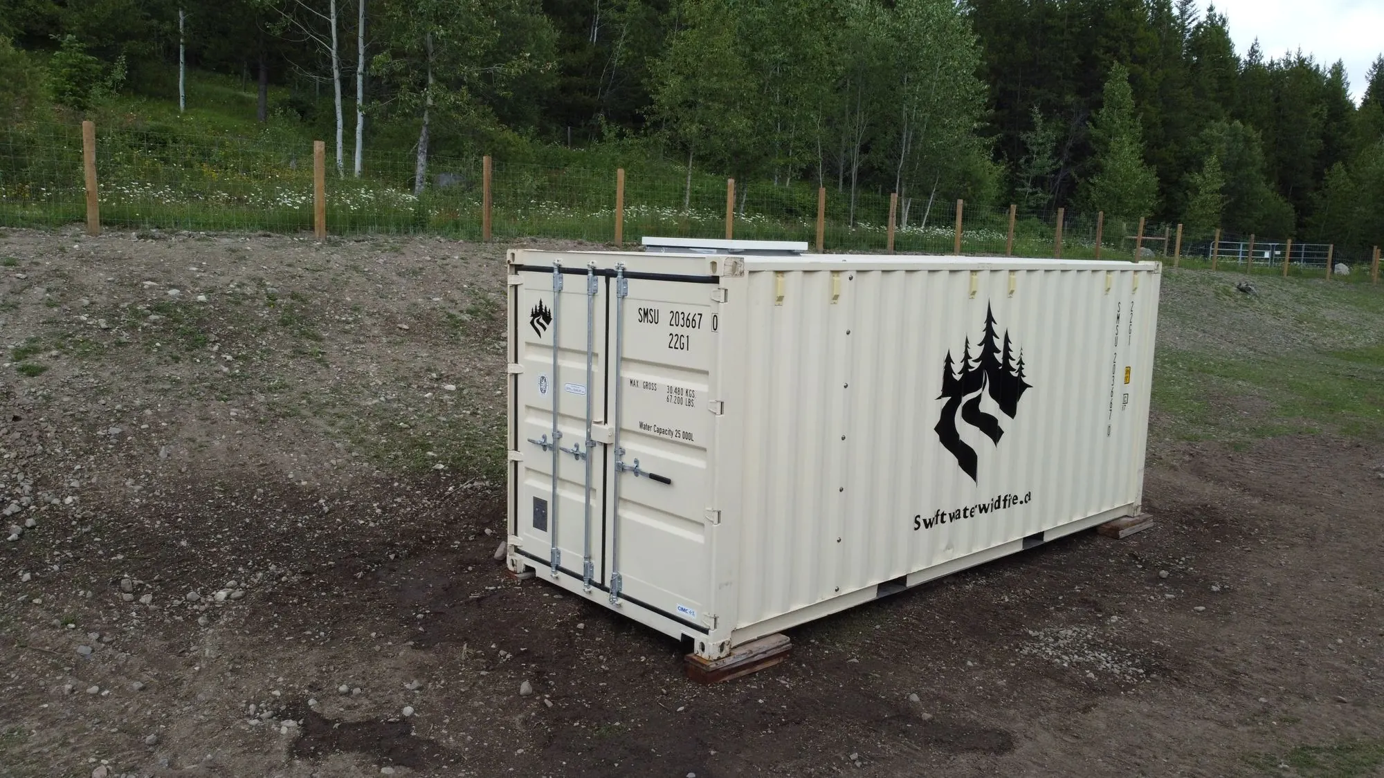 Swiftwater SMS container on site in a cleared forest staging area